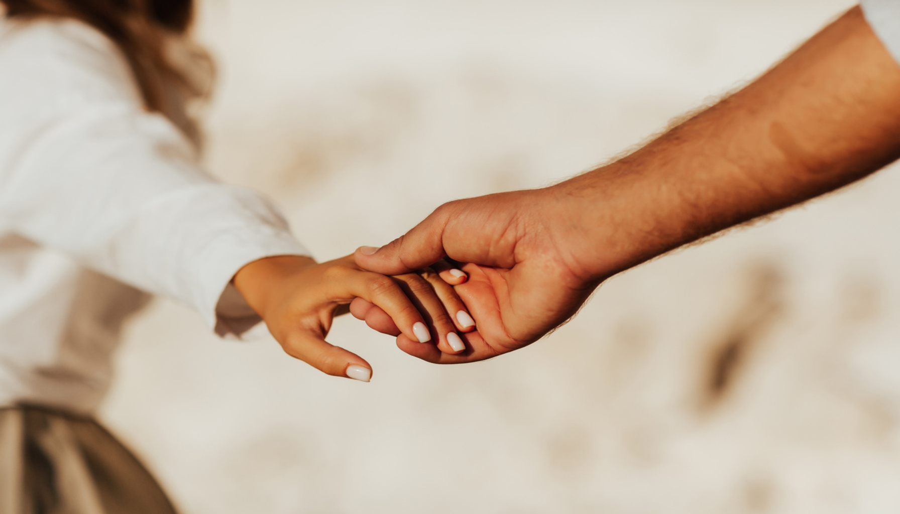 Lovely couple holding hands on white background. Couple together